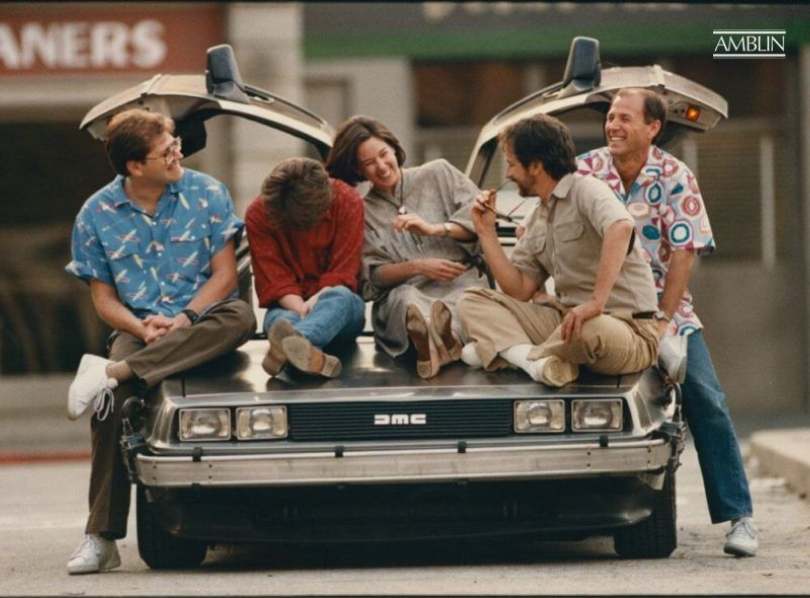Sharing laughs during a publicity shoot for Back to the Future, from L to R: co-writer/director Robert Zemeckis, actor Michael J. Fox, and executive producers Kathleen Kennedy, Steven Spielberg and Frank Marshall.